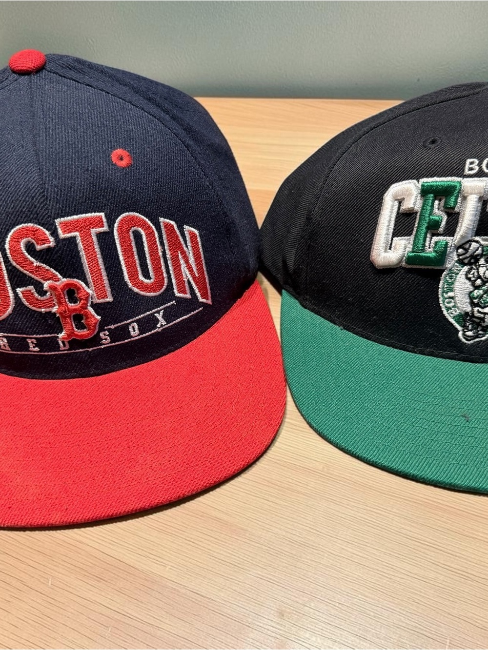 Pair of Men’s Boston Red Sox and Celtics hats/caps